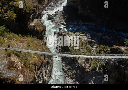 the old Larche Dibhan bridge over the Dudh Khosi River on the trek up to Namche Bazar in Nepal Stock Photo