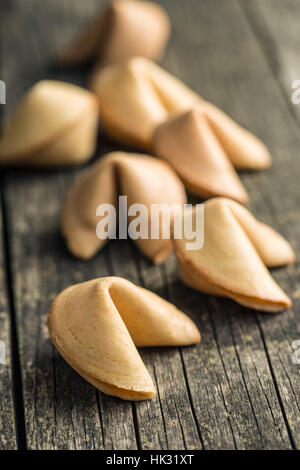 The fortune cookies on old wooden table. Stock Photo
