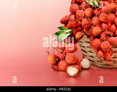 Lychee on red solid background Stock Photo