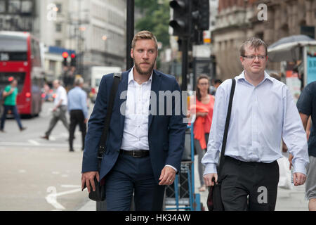 LONDON, UK - MAY 17, 2016: People walking through the City of London street. City of London business life concept Stock Photo