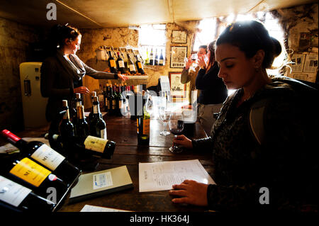 Tourists wine tasting at Muratie Wine Farm, Stellenbosch, South Africa Stock Photo