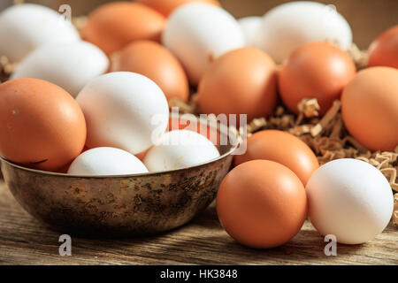 Brown eggs on a wooden surface Stock Photo