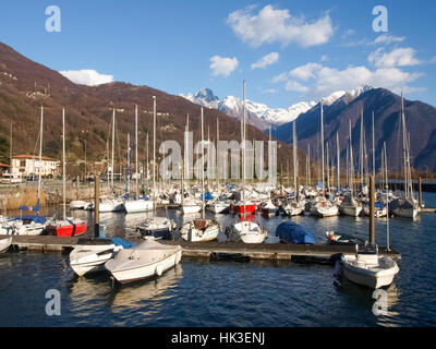 Lake of Como, Italy. Port of Gera Lario with moored boats and mountains. Boats moored in the harbor Stock Photo