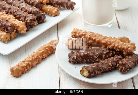 Still life with chocolate covered cookie sticks Stock Photo