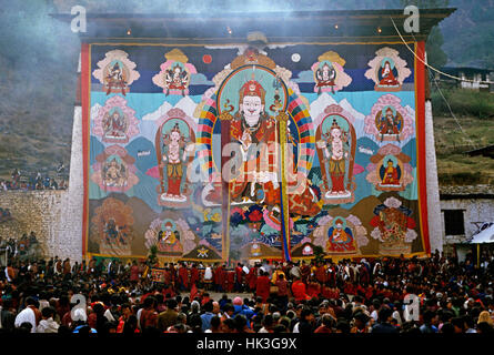 The Thangka, a large tapestry, at the Paro Festival during the religious ceremony. The Thangka depicts the Buddha Guru Rinpoche who introduced Buddhism to Bhutan in the 8th Century Stock Photo