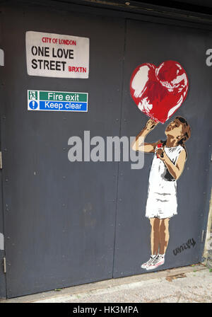 Street art in Brixton London, England, UK - One Love street girl with balloon Stock Photo