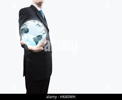 Young businessman holding Earth planet in palm Stock Photo