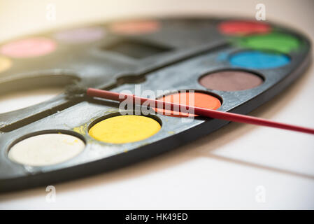 Palette of water color tray on white background, Art metaphor concept, close up, selective focus Stock Photo