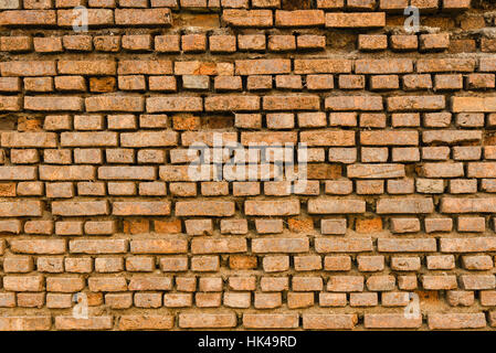 Old Ancient Vintage Grunge Dusty Orange Brick Wall With Some Cracked Bricks Texture Background Stock Photo
