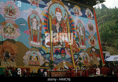 The Thangka, a large tapestry, at the Paro Festival during the religious ceremony. The Thangka depicts the Buddha Guru Rinpoche who introduced Buddhism to Bhutan in the 8th Century Stock Photo