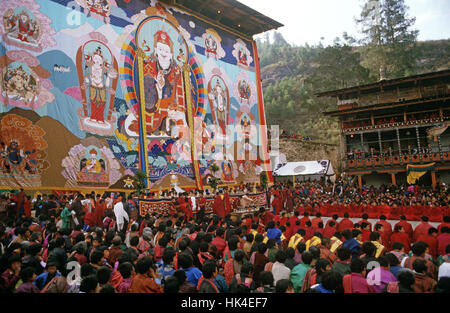 The Thangka, a large tapestry, at the Paro Festival during the religious ceremony. The Thangka depicts the Buddha Guru Rinpoche who introduced Buddhism to Bhutan in the 8th Century Stock Photo