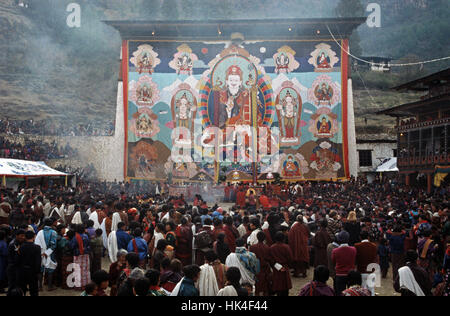 The Thangka, a large tapestry, at the Paro Festival during the religious ceremony. The Thangka depicts the Buddha Guru Rinpoche who introduced Buddhism to Bhutan in the 8th Century Stock Photo