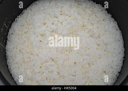 steamed rice in the  inner pot of electric rice cooker Stock Photo