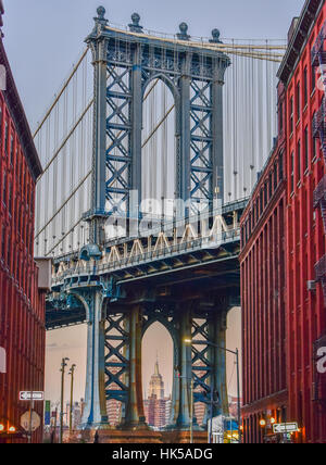 Empire State Building through the Manhattan Bridge in New York City