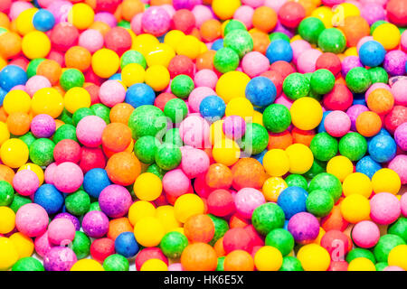 Advertising with colorful candies and colorful confetti background Stock Photo
