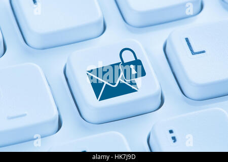 Sending encrypted E-Mail protection secure mail internet symbol blue computer keyboard Stock Photo