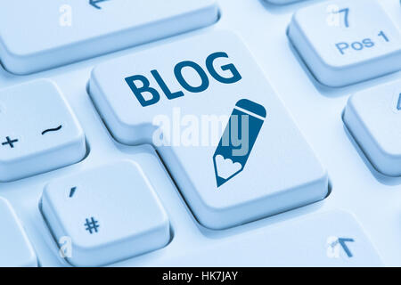 Blog writing online on the internet blue symbol computer keyboard Stock Photo