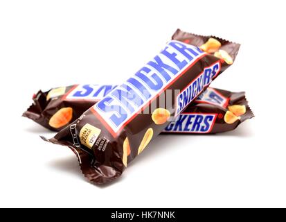 Two wrapped Snickers chocolate bars on white background. Stock Photo