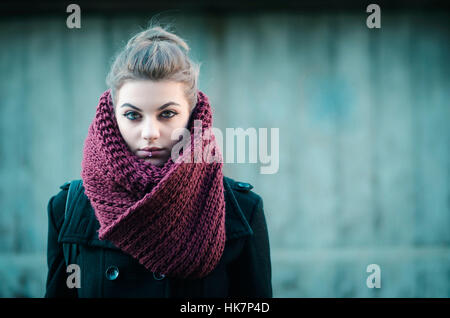 Young hipster grey hair girl with big burgundy scarf looking at the camera Stock Photo