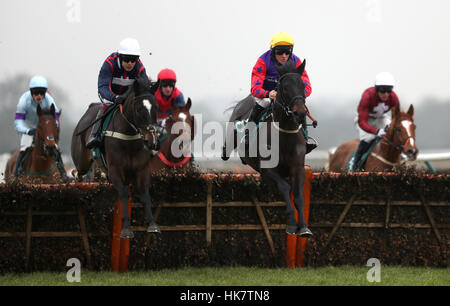 Eventual winner Don Bersy ridden by Aidan Coleman (front left) takes a jump on the first lap of The Cameron Smart Rainbow Race Juvenile Hurdle at Warwick Racecourse. Stock Photo