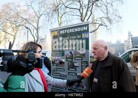 Journalist interviews Brexit supporter with UK Refendum banner at Supreme Court after Article 50 ruling, London UK   KATHY DEWITT Stock Photo