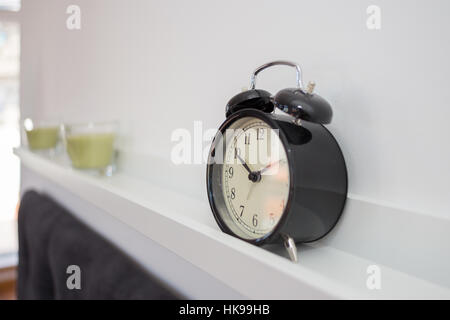 Alarm clock on a shelve Stock Photo