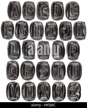 Handmade ceramic letter alphabet painted in black isolated on white Stock Photo