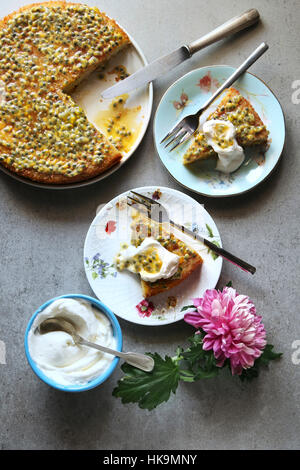 Sponge cake with passion fruit syrup and whipped cream.Top view Stock Photo