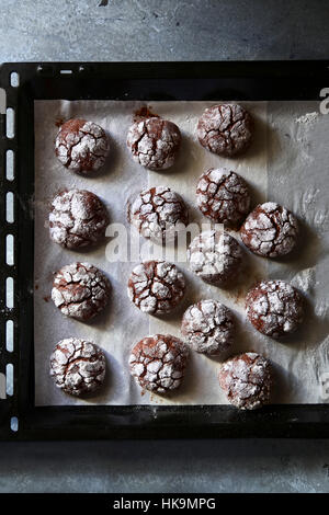 Chocolate crinkle cookies on tray.Top view Stock Photo