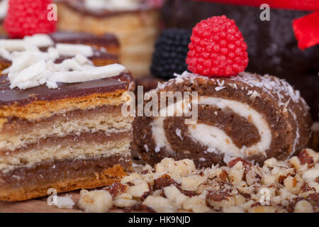 Very tasty chocolate cake on a wooden base, selective focus and small depth of field Stock Photo