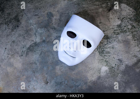 White mask on dark grunge texture , Stock Photo