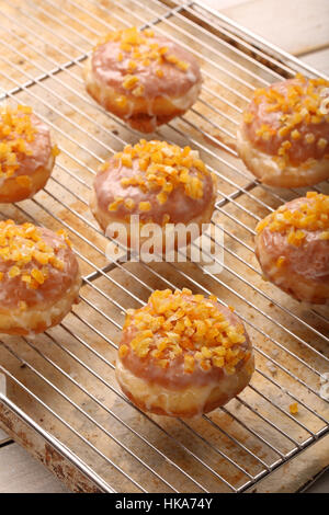 Traditional Polish homemade donuts with rose liqueur and orange Stock Photo
