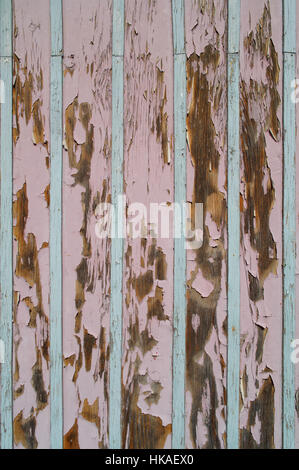 old peeling colorful painted planks as texture Stock Photo