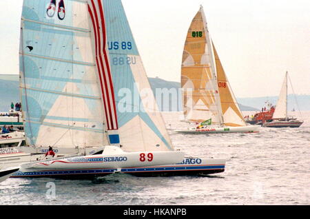 AJAXNETPHOTO. 5TH JUNE, 1988. PLYMOUTH, ENGLAND. - 1988 CARLSBERG STAR SINGLE HANDED TRANSATLANTIC RACE - OSTAR 1988 START -  SEBAGO; SKIPPER, PHILIP STEGGALL (USA). PLACED 4TH IN CLASS, 4TH OVERALL. MIKE BIRCH IN FUJICOLOR IS FURTHEST FROM CAMERA. PHOTO :AJAX NEWS PHOTOS  REF:2880506 19 Stock Photo