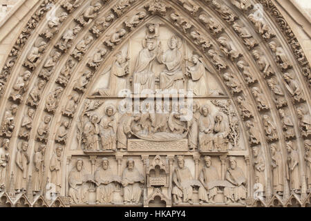 Coronation of the Virgin Mary, Dormition of the Virgin Mary and Three Prophets and Three Kings sitting beside the Ark of the Covenant (from top to bottom). Neo-Gothic tympanum of the portal of the Virgin Mary on the main facade of the Notre-Dame Cathedral (Notre-Dame de Paris) in Paris, France. The damaged Gothic portal was restored by French architects Eugene Viollet-le-Duc and Jean-Baptiste Lassus in the 1840s.