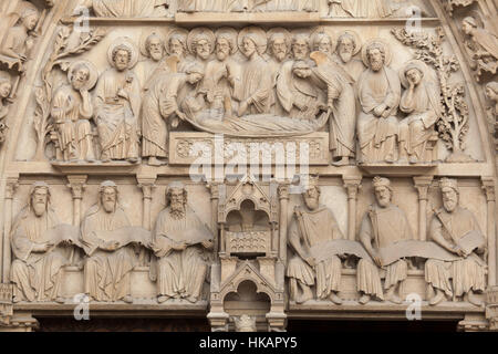 Dormition of the Virgin Mary and Three Prophets and Three Kings sitting beside the Ark of the Covenant (from top to bottom). Detail of the Neo-Gothic tympanum of the portal of the Virgin Mary on the main facade of the Notre-Dame Cathedral (Notre-Dame de Paris) in Paris, France. The damaged Gothic portal was restored by French architects Eugene Viollet-le-Duc and Jean-Baptiste Lassus in the 1840s.