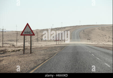 Sand blowing across the road near Luderitz in Namibia Stock Photo