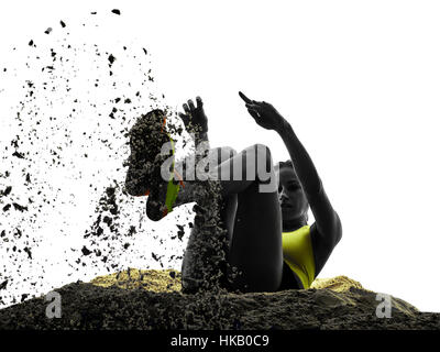 one woman praticing Long Jump silhouette in studio silhouette isolated on white background Stock Photo