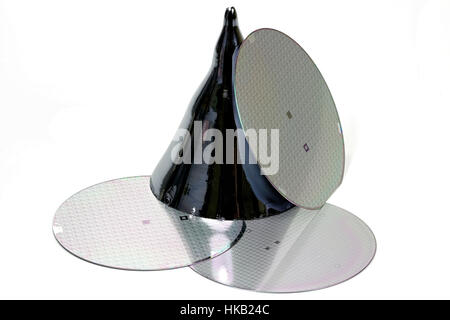 wafers with silicon monocrystal isolated on white background Stock Photo