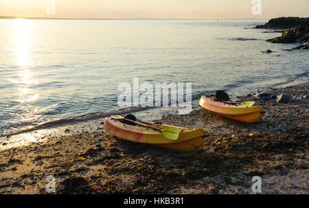 Two sea canoes on the bay in Skerries town, Ireland Stock Photo