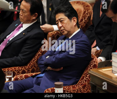 Tokyo, Japan. 26th Jan, 2017. Japanese Prime Minister Shinzo Abe listens to a question by an opposition lawmaker during the Lower House's budget committee session at the National Diet in Tokyo. Abe is expecting to meet with the new U.S. President Donald Trump early next month in Washington to discuss trade issues as Trump signed to withdraw from the TPP trade deal negotiation. Credit: Yoshio Tsunoda/AFLO/Alamy Live News Stock Photo