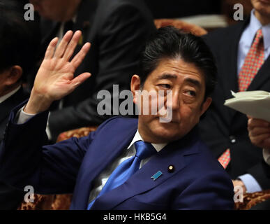 Tokyo, Japan. 26th Jan, 2017. Japanese Prime Minister Shinzo Abe raises his hand to answer a question by an opposition lawmaker during the Lower House's budget committee session at the National Diet in Tokyo. Abe is expecting to meet with the new U.S. President Donald Trump early next month in Washington to discuss trade issues as Trump signed to withdraw from the TPP trade deal negotiation. Credit: Yoshio Tsunoda/AFLO/Alamy Live News Stock Photo