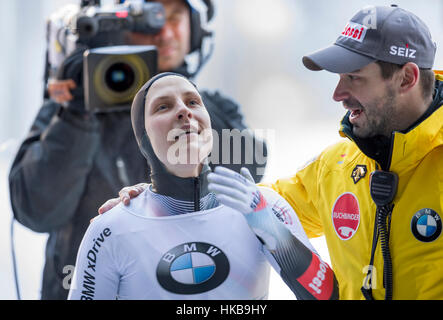 Koenigssee, Germany. 27th Jan, 2017. German Tina Hermann celebrates her second place with coach Christian Baude on the ice rink at the bobsleigh world cup in Schoenau am Koenigssee, Germany, 27 January 2017. Credit: dpa picture alliance/Alamy Live News Stock Photo