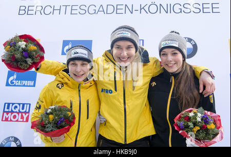 Koenigssee, Germany. 27th Jan, 2017. The three Germans Tina Hermann (2nd place- l-r), Jacqueline Loelling (1st place) and Anna Fernstaedt (3rd place) standing at the flower ceremony of the bobsleigh world cup in Schoenau am Koenigssee, Germany, 27 January 2017. Credit: dpa picture alliance/Alamy Live News Stock Photo