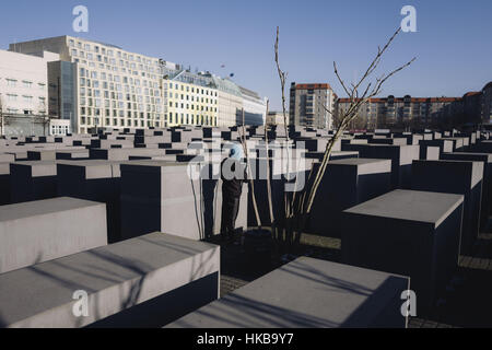 Berlin, Berlin, Germany. 27th Jan, 2017. The Memorial to the Murdered Jews of Europe also known as the Holocaust Memorial (German: Holocaust-Mahnmal) on the International Holocaust Remembrance Day, an international memorial day on 27 January. The monument is composed of 2711 rectangular concrete blocks, laid out in a grid formation. Credit: Jan Scheunert/ZUMA Wire/Alamy Live News Stock Photo