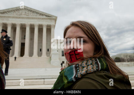 Washington, DC, USA. 27th January, 2017.Thousands of pro-life activists march from the National Mall to the Supreme Court building for the annual Pro-Life March.  Many pro-choice activists also gather in front of the Supreme Court, where both sides protest side by side. Credit: B Christopher/Alamy Live News