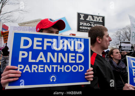 Washington, DC, USA. 27th January, 2017.Thousands of pro-life activists march from the National Mall to the Supreme Court building for the annual Pro-Life March.  Many pro-choice activists also gather in front of the Supreme Court, where both sides protest side by side. Credit: B Christopher/Alamy Live News Stock Photo