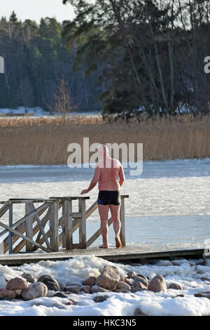 Winter swimmer ready for cold water in Finland. Stock Photo