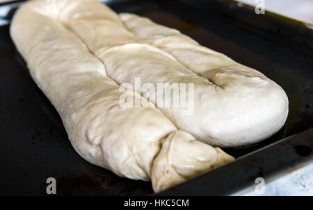 Making of Homemade Apple Strudel, Pie, Burek or other kind of pastry appetizer or sweets on a backing Tray. Stock Photo