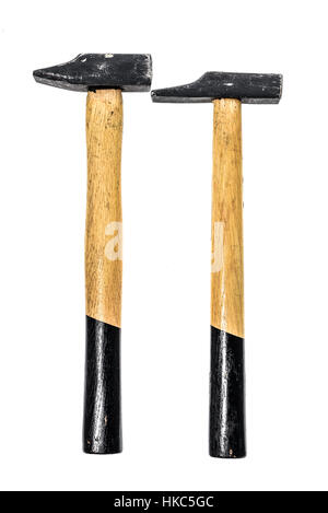 Two old, used hammers isolated on a white background. Black and yellow working tool with wooden handle and metal head. Stock Photo
